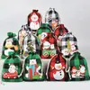 Bolsa de algodón con cordón de Navidad al por mayor bolsa de almacenamiento de dulces y regalos Bolsa de algodón con diseño de pingüino a cuadros navideños personalización