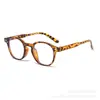 Gafas de sol redondas con remaches para mujer, nuevo estilo retro ins europeo y americano, gafas de sol transfronterizas, protección solar personalizada, gafas planas de estilo callejero