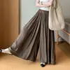 Nuevo estilo de otoño, pantalones-falda plisados de cintura alta elástica con cinturón, de caída fluida y diseño único para mujer