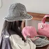 Otoño y Corea del Sur Sombrero Infantil Moda de Verano Rayas Niñas Bolsa Protectora Solar Sombrero de Pescador Sombrero de Sol para Bebé
