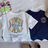 2026 Nueva Camiseta de Manga Corta de Verano para Niños Algodón Puro Niños y Niñas Estilo Japonés Camiseta Base de Color Sólido para Bebé Marca de Moda Letra t