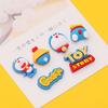 Accesorios para funda de teléfono de manzana Doraemon DIY Accesorios para hebilla de zapato Parche de resina Doraemon JUGUETE papelería Accesorios para vaso de agua