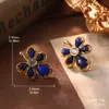 Pendientes vintage de turquesa, pendientes de nicho de alta calidad, pendientes de abanico con borlas y perlas de mariposa, nuevos pendientes de moda que combinan con todo para mujer.
