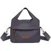 Bolsa de ombro feminina 2026 primavera e outono novo tecido de nylon bolsa de mão urbana simples casual bolsa de mãe bolsa transversal