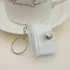 Nuevo mini álbum de fotos de PVC con llavero y bolsillo para insertar fotos, álbum de fotos para identificación, 1 pulgada, 2 pulgadas, venta al por mayor