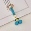 Item Popular Transfronteiriço: Chaveiro de Cereja em Argila Cerâmica com Strass, Pingente para Chave de Carro, Pingente Brilhante de Cereja com Strass para Bolsa, Chaveiro