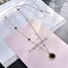 Cadena de suéter exquisita estilo coreano de acero de titanio color oro rosa otoño e invierno collar largo decorativo para mujer moda a cuadros blancos y negros versátil