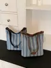 Bolso tipo cubo versátil y simple de verano, diseño de bolso tote de gran capacidad estilo fresco para el trabajo, nuevo bolso de hombro 2026