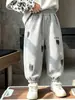 Ropa infantil pantalones para niños primavera y otoño 2026 nuevo estilo pantalones deportivos para niños pantalones de chándal casuales para niños pantalones largos para niños