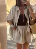 Conjunto casual suelto para mujer, camisa de lino y algodón a rayas de verano transfronterizo europeo y americano con bolsillos y pantalones cortos NTZ6010