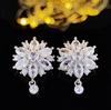 Mejores vendidos de comercio electrónico transfronterizo aretes de flor aretes de hada de cobre incrustados con circonita moda sentido de alta gama nicho alta gama e8065