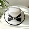 Sombrero femenino verano estilo coreano lazo grande sombrero de paja de playa viaje vacaciones protección solar sombrero para el sol sombrero de paja tejido estilo Chanel tipo cubo