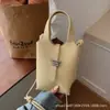 Bolsa Feminina Estilo Cesta com Padrão de Lichia Transfronteiriça Modelo Novo 2026 Bolsa de Ombro Texturizada Bolsa Transversal Casual Bolsa Saco