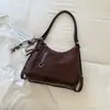 Mochila de Felpa de Gamuza Súper Caliente para Mujer 2026 Nueva de Gran Capacidad Bolso de Hombro Retro Mate Versátil para Viajar Bolso Cruzado