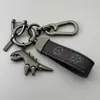 Chaveiro de Dinossauro Fofo Desenho Animado Pingente de Metal Estilo Casal para Carro Masculino Chaveiro de Corda de Couro de Alta Qualidade para Pendurar na Cintura