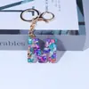 Llavero de Resina con Lentejuelas Letra Inglesa Transfronterizo Europeo y Americano Sentido Avanzado Morado Lindo Colgante para Bolsa Mochila Llavero Adornos