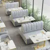 Cafetería minimalista y lujosa, restaurante occidental, asientos en cabina, sofá, tienda de postres y té de leche de moda, rincón de lectura informal, juego de mesa y sillas, cuero