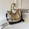 Bolsa de Lona para Mulheres 2025 Novo Estilo Bolsa Tote de Grande Capacidade Bolsa para Mamãe Bolsa de Ombro Casual para o Dia a Dia com um Toque de Luxo