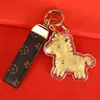 Fique Rico Imediatamente Chaveiro de Ouro Desenho Animado Zodíaco Chave de Carro Pingente Dourado Casal Ornamento Fofo Venda por Atacado de Fábrica