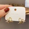 Aretes Casuales Elegantes Femeninos de Corazón Rollo de Crema para Mujer Diseño Exquisito Aretes de Línea Calada Nueva Tendencia 2025