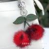 Nuevo llavero de cuero con bola de pelo bicolor Guangdong felpa colgante de cereza colgante exquisito accesorios para equipaje joyería de felpa