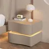 Mesita de noche color crema 2026, uso doméstico creativo para el dormitorio, nuevo almacenamiento de mesita de noche moderno minimalista de alta gama de madera maciza