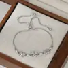 Nuevo Estilo 2025 Joyería de Mano Personalizada Incrustada con Circonita para Mujer, Lazo de Piedra Ojo de Gato de Alta Gama, Pulsera Ajustable Deslizante