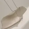 Collar Sencillo y Elegante con Colgante de Lazo Nudo Concentrico para Mujer, Serie Estilo Celebridad de Internet de Nicho, Cadena para Clavícula Chapada en Oro de 18K