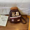 Mochila de Oso Pequeño de Dibujos Animados Linda para Mujer 2026 Nueva Mochila Ligera de Gran Capacidad de Mano Viaje Nicho Bolso Escolar