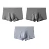 Venta al por mayor de ropa interior para hombre Huajielong de color liso con textura de malla, bóxers transpirables de cintura media para tallas grandes, disponibles para dropshipping