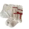 Calcetines para Mujer en Otoño e Invierno Calientes Rojos de Lana Calcetines de Mujer Calcetines de Media Caña con Lazo Lindos de Dibujos Animados Calcetines de Año Nuevo Medias
