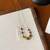 Colar Vintage Estilo Americano com Pedra Olho de Tigre para Mulheres 2026 Novo Modelo Corrente de Suéter de Alta Qualidade Acessório Corrente de Pescoço de Luxo Leve Nicho Pingente