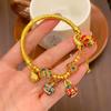 Transmisión en vivo mismo estilo alta protección del color estilo antiguo color esmalte arena dorada familia de bestias doradas tres Jiyan pulsera media femenina venta al por mayor