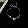 Colgante de Flor Hueca Ovalada de Corazón de Zircón Pulsera Deslizante Pulsera de Lujo Ligero de Gama Alta Pulsera de Moda Versátil