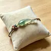 Nuevo brazalete de pez tejido con cuerda colorida estilo chino, con una estética china clara y elegante, moderno y único, realza el cutis y es bellamente simple y elegante