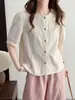 Nueva camisa de moda coreana para mujer, primavera temprana 2026, cuello redondo, manga corta bordada, corte holgado, adelgazante, versátil y rejuvenecedora.