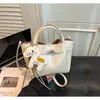 Bolso plisado coreano para mujer, nuevo y moderno de moda de verano 2026, bolso tipo cesta con cierre, bolso cruzado versátil