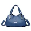 Bolso de alta calidad y estilo para mujer, colección otoño/invierno 2026, con un diseño sencillo, múltiples compartimentos y se puede llevar en la mano o colgar como bolso de hombro o bandolera.