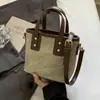 Bolsos de nicho texturizados de alta calidad 2024 nuevos bolsos para mujer versátiles bandoleras retro de hombro bolsos cubo portátiles de moda