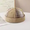 Gorro unisex de cuadros de retazos a la moda, ajustable, gorro tipo calavera retro versátil casual de nicho para cuatro estaciones