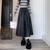 Falda de cuero PU de cintura alta para tallas grandes para mujer, nueva falda de línea A para primavera/otoño 2026, falda corta adelgazante y que se ajusta a la figura, moderna