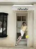Top de punto off-shoulder estilo 'woppei pure desire' para mujer, principios de otoño 2026, ligero, versátil, top que realza la clavícula