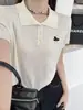 Top blanco de verano para mujer con cuello polo de hombro recto, hecho de seda helada, de manga corta, nuevo estilo popular 2026, para combinar con una falda