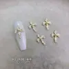 Accesorios para arte de uñas de aleación con forma de cruz gótica oscura transfronterizos, pendientes vintage europeos y americanos, accesorios de pedrería para uñas estilo punk gótico