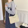 Bolso tejido transfronterizo nuevo, bolso de hombro de moda para mujer, bolso de paja simple calado, bolso cruzado de color liso para vacaciones en la playa