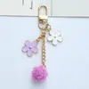 Ins estilo japonés flor de cerezo llavero colgante corazón de chica linda hueco cadena de teléfono funda para auriculares decoración de bolsa