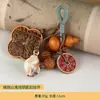 Colgante llavero de hueso de durazno, colgante vaina de paz de semilla de hueso de durazno, accesorio de bolso de regalo de nicho de alta gama