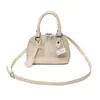 Nova moda primavera bolsa tiracolo de ombro único, bolsa feminina de textura simples 2026, bolsa concha personalizada de design nicho