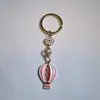Colgante de Serie Ojo de Diablo Transfronterizo Europeo y Americano Colgante de Llavero de Joyería de Animales Ojo de Hueso con Goteo de Aceite Accesorios de Aleación para Mujeres