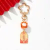 Amuleto estilo INS gato de la suerte de cerámica flor de ciruelo llavero colgante metálico decoración para bolso para buena suerte y salud